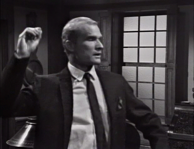 Roger throws a dart in Bill's direction