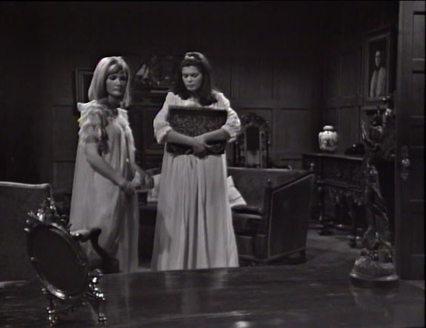 Vicki holds the book several feet from the table